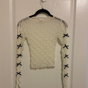 Full Tilt Cream Top with Black Bow Accents